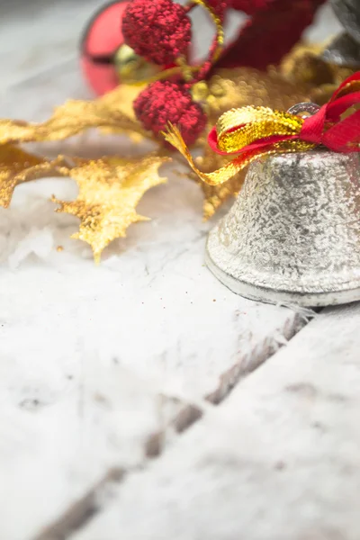 Jingle bell on wooden surface with copy space — Stock Photo, Image