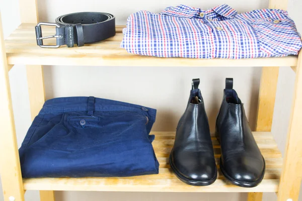 Men's clothes on the shelf — Stock Photo, Image