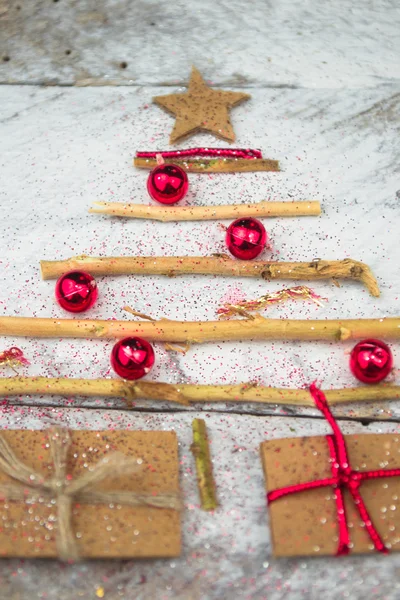 Christmas tree made of cardboard gift on wood background — Stock Photo, Image