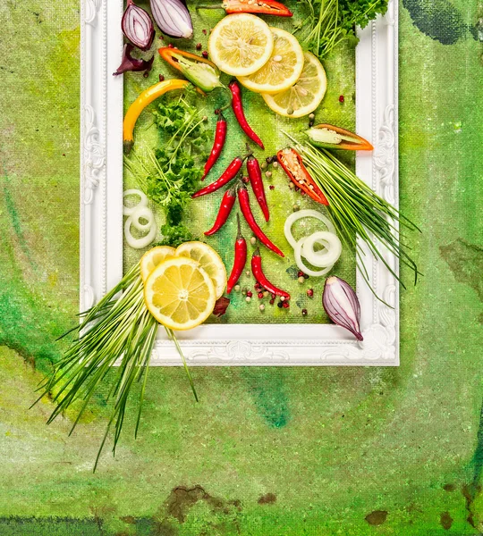 frame with chives, spices and lemon slices