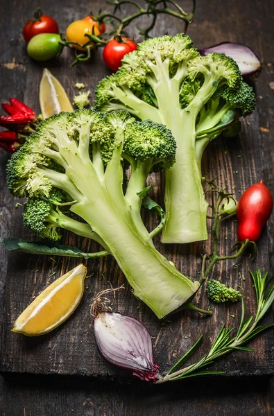 Fresh broccoli with ingredients for cooking — Stock Photo, Image