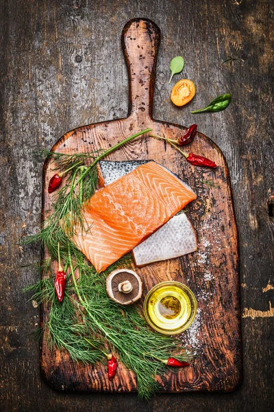 Raw salmon fillet with ingredients — Stock Photo, Image