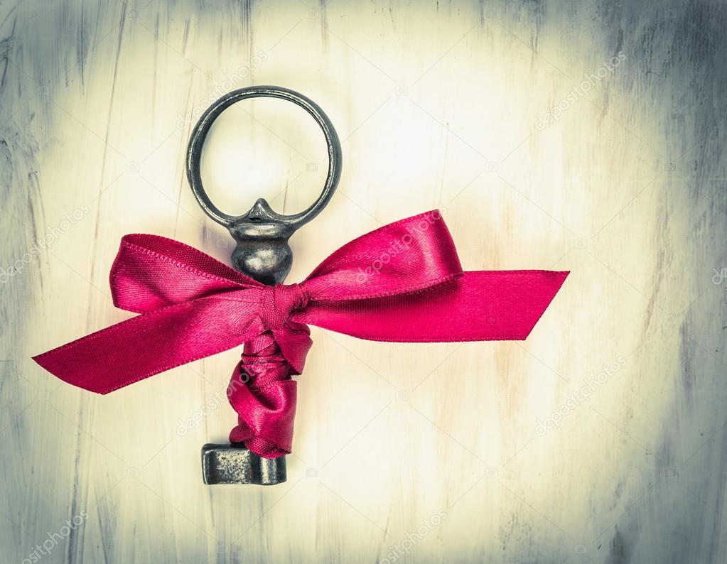Antic key with red ribbon , valentine, toned
