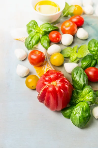 Tomatoes mozzarella salad making — Stock Photo, Image