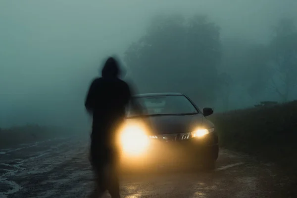 Ghostly Blurred Hooded Figure Moving Front Car Headlights Spooky Country — Stock Photo, Image
