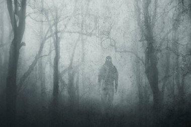 A dark scary concept. Of a mysterious supernatural figure, walking through a forest. Silhouetted against trees. On a foggy winters day. With a grunge, textured edit.  clipart