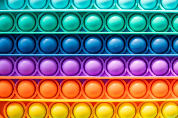 Helles Regenbogenspielzeug Antistress Für Kinder Und Erwachsene Auf Buntem Hintergrund — Stockfoto