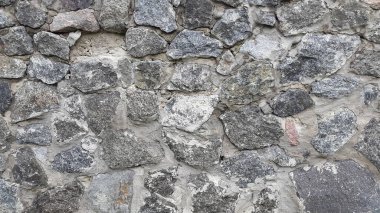 Granit duvar ustası. Granit taşlardan duvar. Eski arkaplan