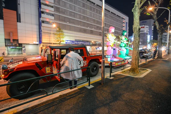 Red party hummer with anime robots In Tokyo, Japan — Stock Photo, Image