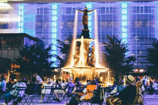 CINCINNATI, OH - CIRCA 2011: people Fountain Square in the downtown of Cincinnati, OH, USA at night time circa summer 2011.