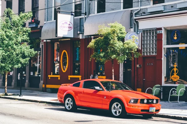 CINCINNATI, OH - CIRCA 2011: red mustang car parked on the street in Clifton neighborhood in Cincinnati, OH, USA at summer 2011. — Stock Photo, Image