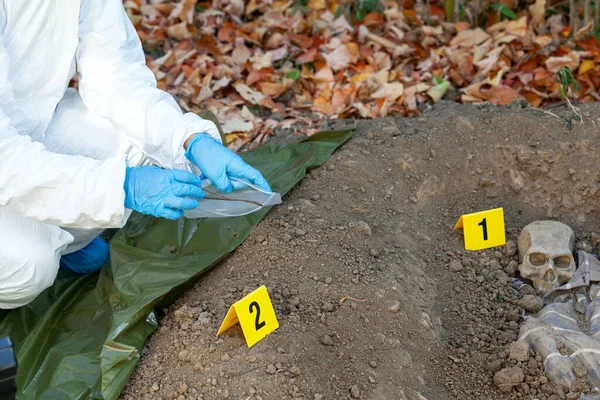 War crime investigation. Forensic science specialist at work.