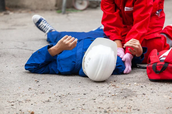 Workplace or work accident at construction site. First aid and CPR training.