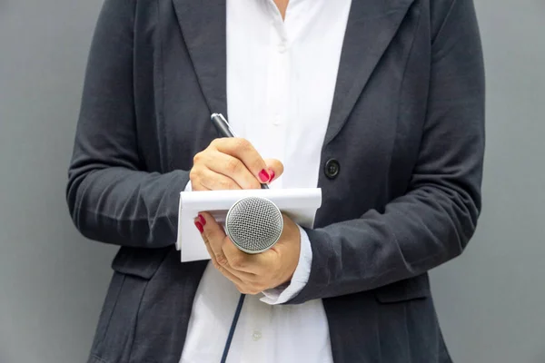 Public Relations Officer Media Event Holding Microphone Making Notes Preparing Стокове Фото