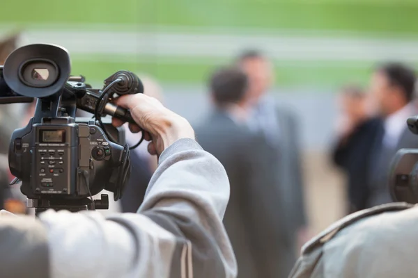 Filming an event with a video camera Stock Image