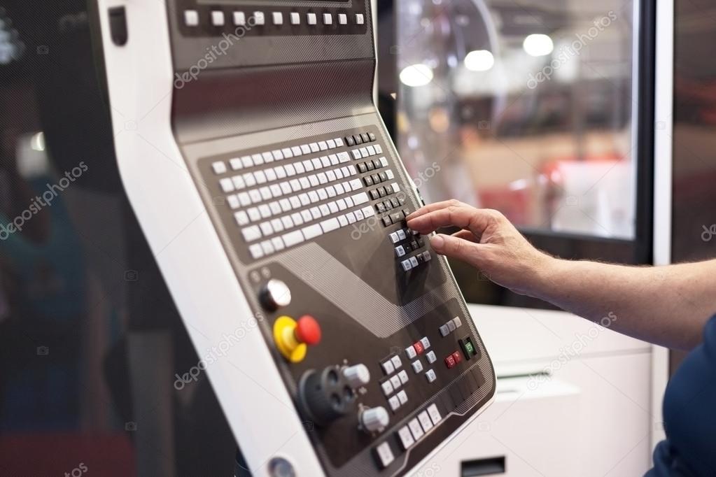 Man working at programmable machine 