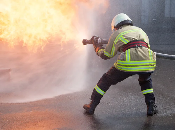 Firefighter in action — Stock Photo, Image