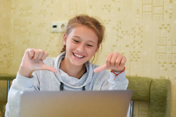 girl talking online internet on a laptop. remote virtual communication.