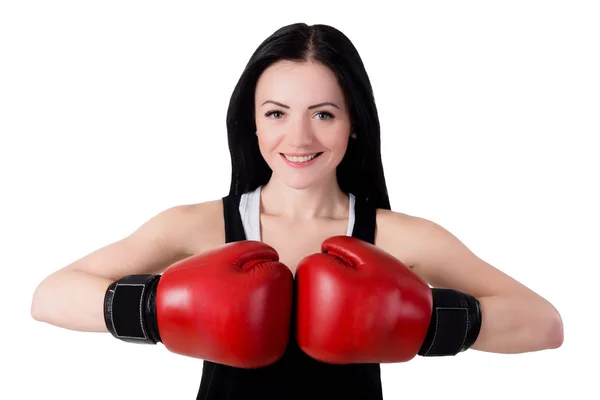 Portrait of a smiling young brunette woman with red boxing glove Royalty Free Stock Photos