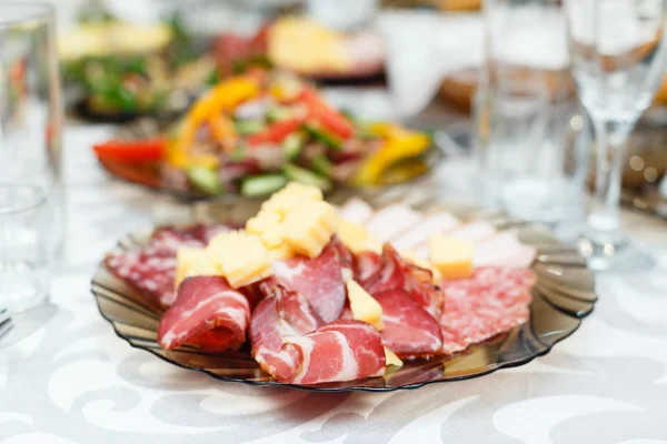Meat cold cuts on a banquet table — Stock Photo, Image