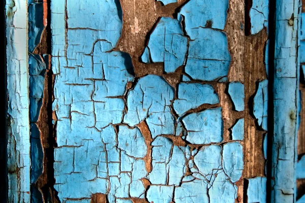 古い木の壁の質感と剥がれた青の塗料の抽象的な背景 — ストック写真