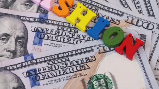 Parola Rotante Moda Lettere Colorate Uno Sfondo Banconote 100 Dollari — Video Stock