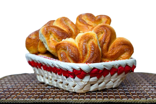 Fresh homemade buns in a basket on a bamboo tray on a white back — Stock Photo, Image