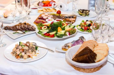 salads and cold cuts at the banquet table