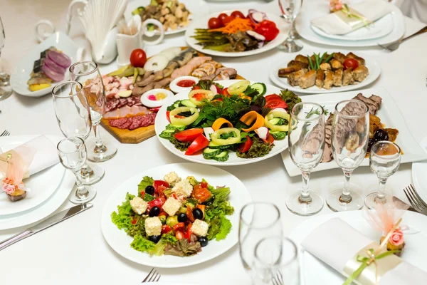 salads and cold cuts at the banquet table