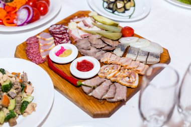 meat cutting on wooden plate on banquet table