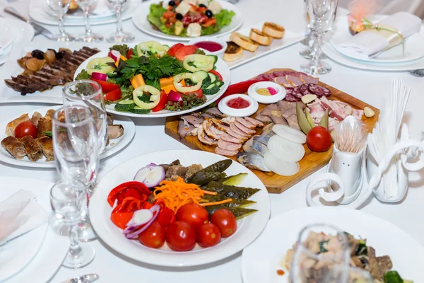 Pickles and cold cuts at the banquet table — Stock Photo, Image