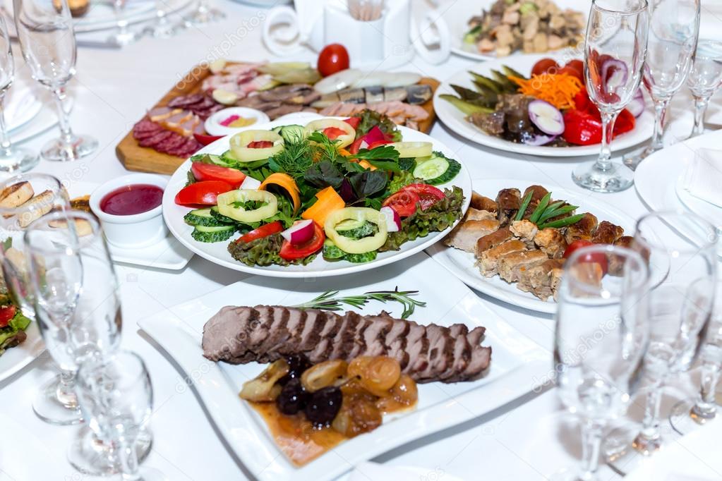 salad and cold meats at the banquet table