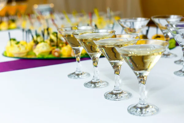 Four glasses of champagne on the banquet table — Stock Photo, Image