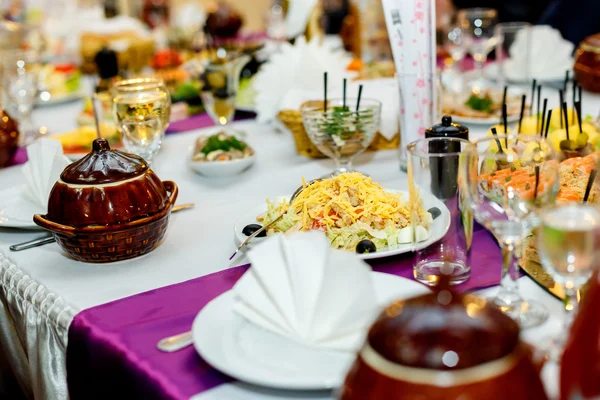 Appetizers and salads at the banquet table — Stock Photo, Image