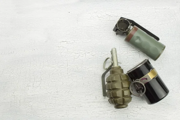 Hand grenade on shadowed, cracked background. War game. Sales of weapons. — Stock Photo, Image