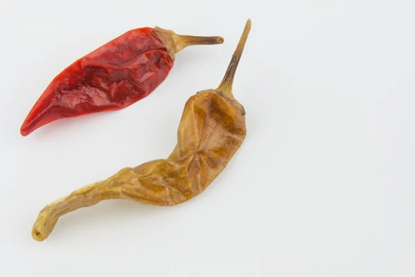 Dried chili peppers on a white background. Strong spices for spicy foods. — Stock Photo, Image