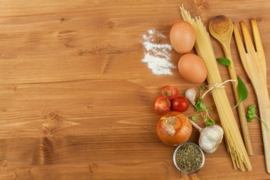 Homework pasta foods. Ingredients for cooking, spread out on the kitchen table. Traditional Italian food. Diet food.