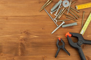 Set of tools and instruments on wooden background. Different kinds of tools for household chores. Home repairs. Father's Day.
