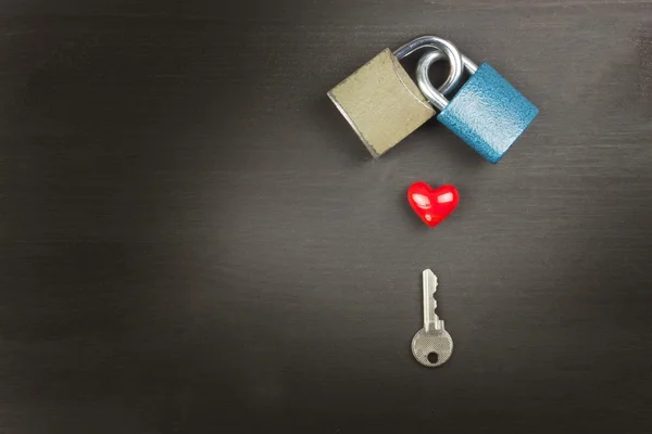 Locks and keys on a wooden table. New Symbol of love and happiness. Lock and heart. Key to the heart. Locked love. Harmony of souls.