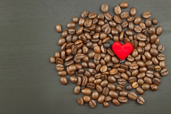 Sales of coffee. Coffee beans on wooden background.