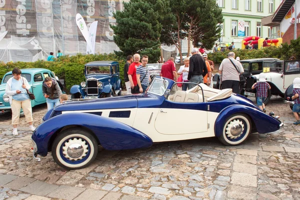 TISNOV, CZECH REPUBLIC - SEPTEMBER 3, 2016:  The traditional meeting of fans of vintage cars and motorbikes. An exhibition of old cars in the town square of Tisnov. Detail of veteran cars