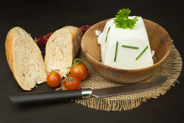 Goat cheese with fresh tomatoes on wooden table. Fresh cheese and pastries. Diet food. Goat cheese with vegetables. — Stock Photo, Image