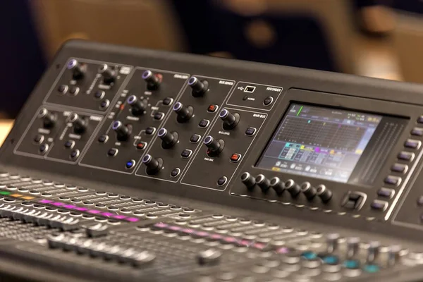 buttons equipment in audio recording studio. Professional concert mixing console is equipped with high-precision and long-stroke faders.