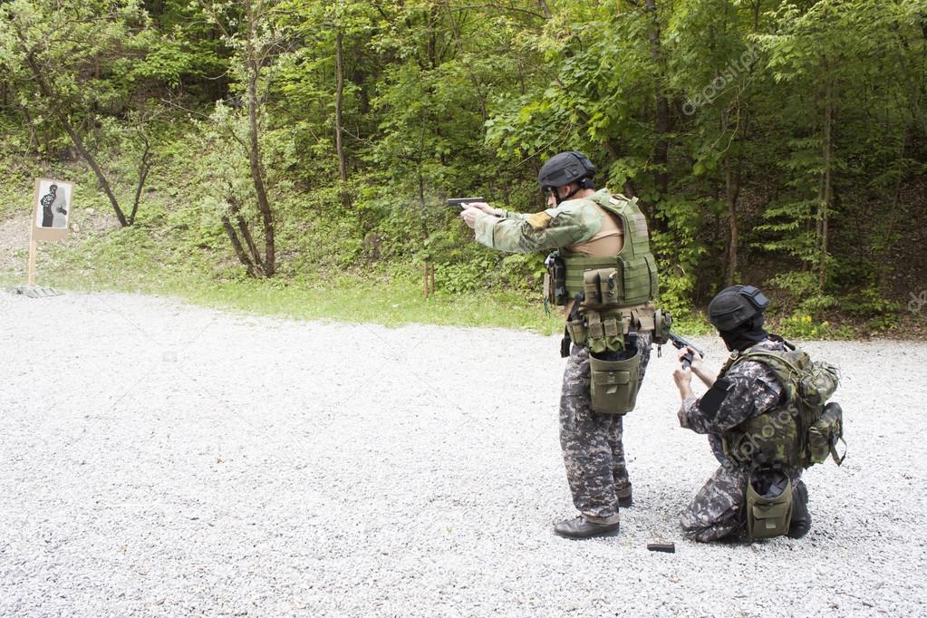 Special police unit in training, school, pistol shooting, outdoor shooting range