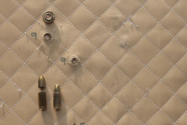 Hit shot 9mm in Kevlar bulletproof vest — Stock Photo, Image