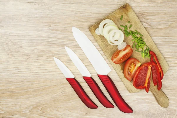 Homework vegetable salad. Ceramic paring knife. — Stock Photo, Image