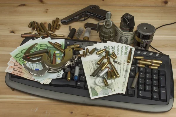 Internet illegal arms trade. Merchant arrest illegal ammunition. Internet crime. Current euro banknotes and Czech koruna. — Stockfoto