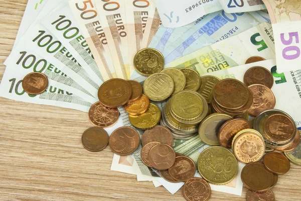 Euro coins and banknotes on the table. Detailed view of the legal tender of the European Union, EU. The uncertain future of the euro. — Stock Photo, Image