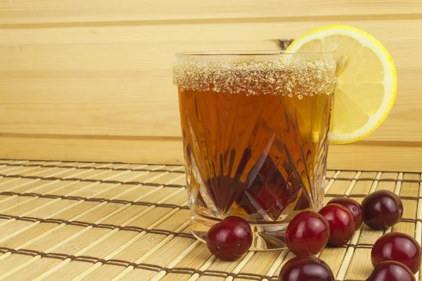 Glasses with cherries with rum. Preparing for summer refreshment cocktail. Cane rum and sugar. Sour pickled in rum. — Stock Photo, Image