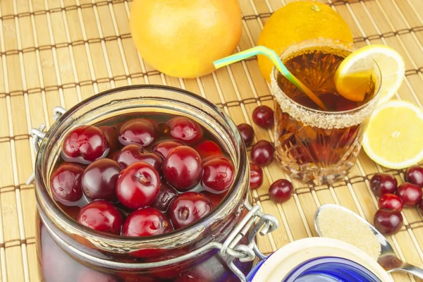 Glasses with cherries with rum. Preparing for summer refreshment cocktail. Cane rum and sugar. Sour pickled in rum. — Stock Photo, Image